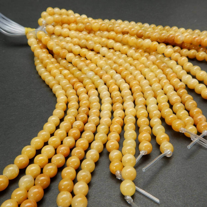 Yellow jade large hole loose beads.