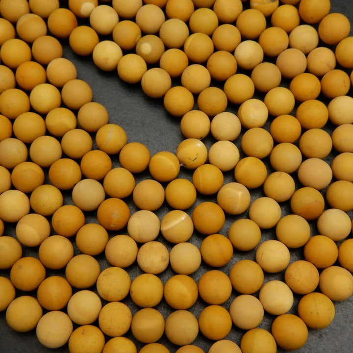 Matte finish yellow mookaite beads.