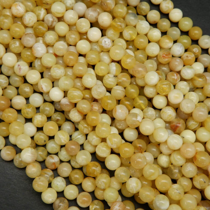 Natural Yellow Opal Beads. Round yellow beads on a string for jewelry making.