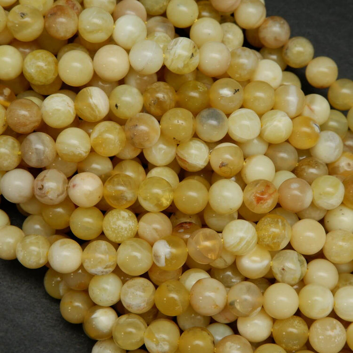 Natural Yellow Opal Beads. Round yellow beads on a string for jewelry making.