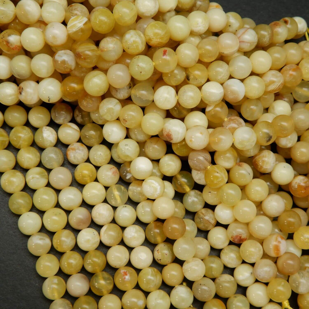 Natural Yellow Opal Beads. Round yellow beads on a string for jewelry making.