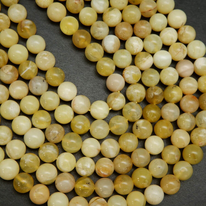 Natural Yellow Opal Beads. Round yellow beads on a string for jewelry making.