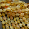 Yellow opal polished pebble beads.