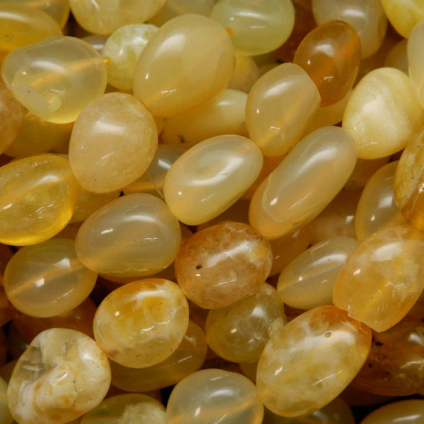 Yellow opal polished pebble beads.