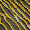Beige and yellow roman glass tube beads.